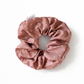 milk chocolate scrunchie with white micro heart on a white background