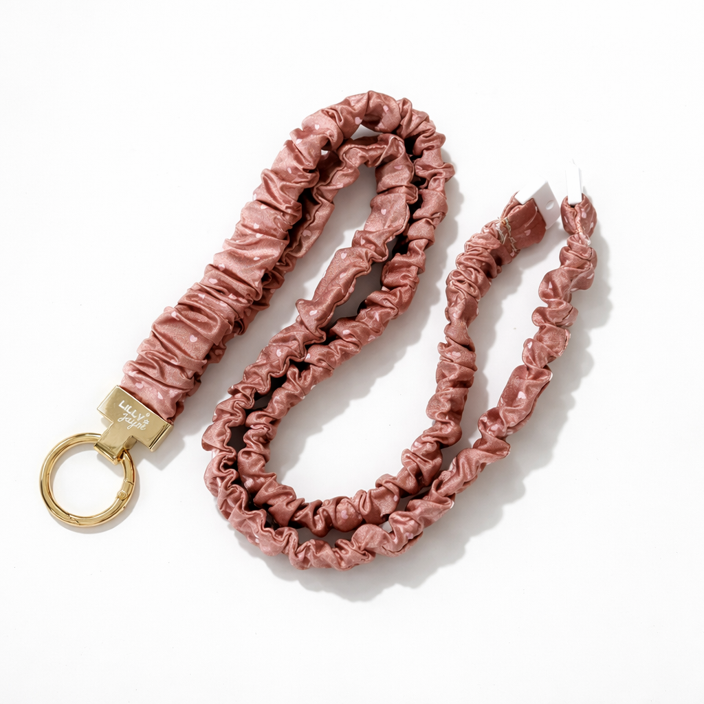 milk chocolate scrunchie-style keychain with a gold ring on a white background