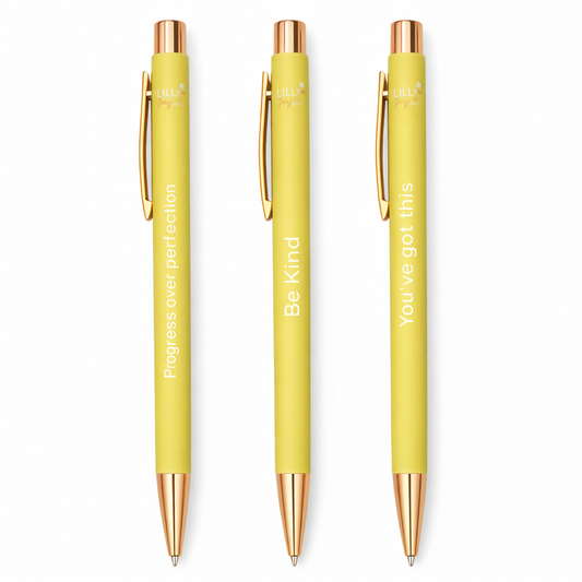 Three yellow pens with rose gold accents on a white background