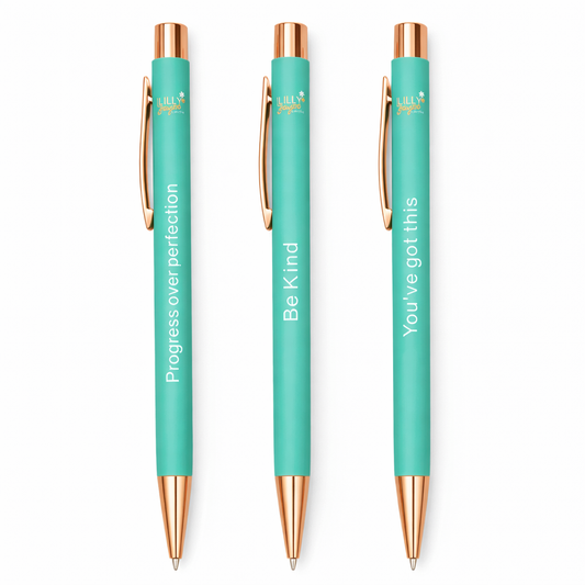 Three teal pens with rose gold accents and motivational quotes on a white background