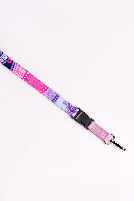 Pink and purple patterned lanyard with a keychain attachment on a white background