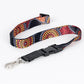 Colorful patterned lanyard with a black clip on a white background