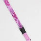Pink lanyard with black strap on a white background