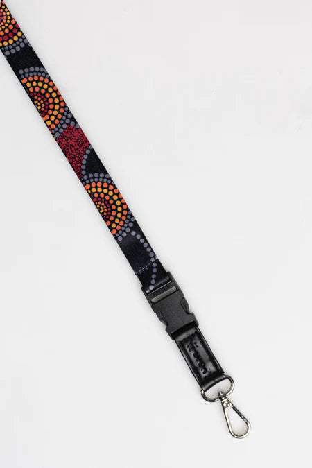 Multicolored beaded lanyard with a black clip on a white background