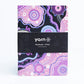 Pack of yarn notebooks with a purple and black design on a white background