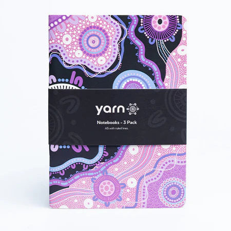 Pack of yarn notebooks with a purple and black design on a white background