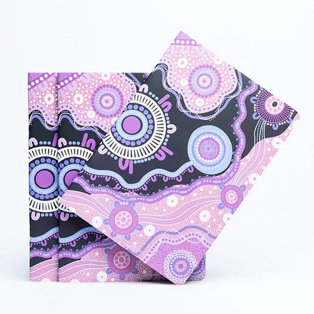 Folded fabric with purple and black pattern on a white background - aboriginal art