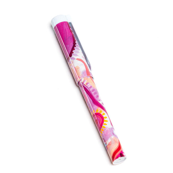 Pink and white hairbrush with floral design on a white background