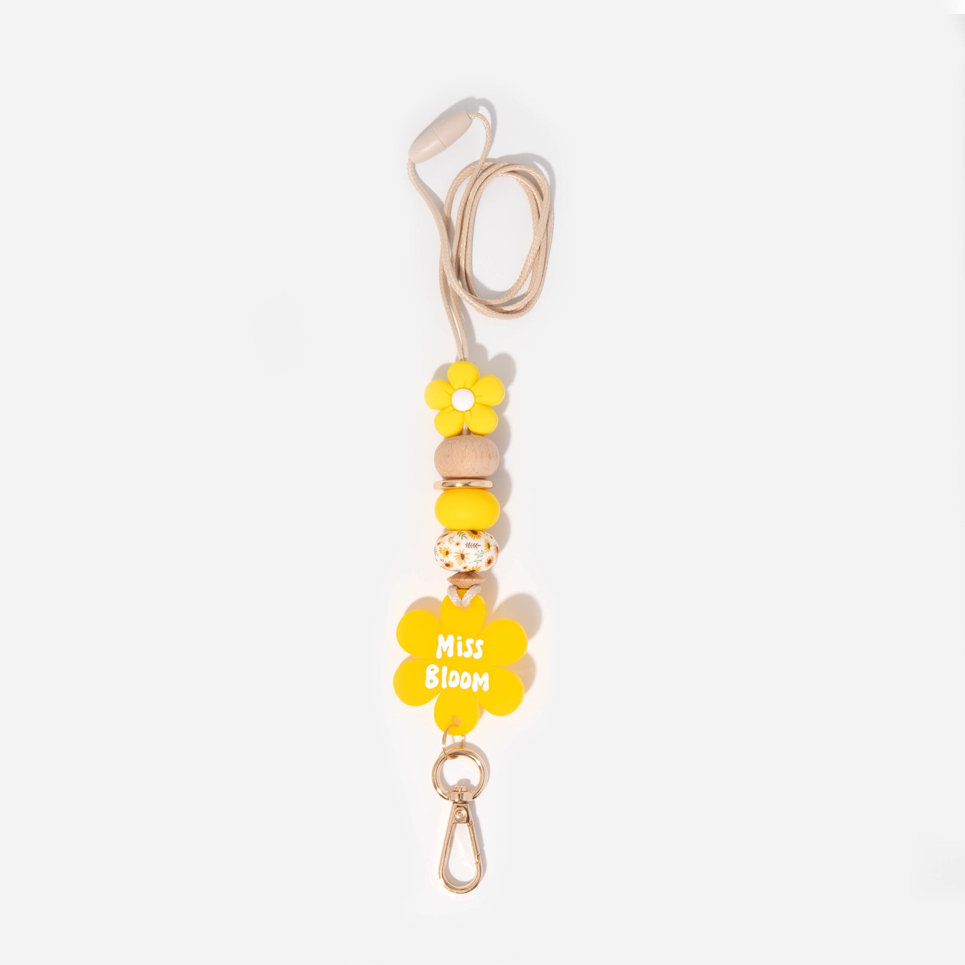 Lanyard with yellow flower silicone focal beads and a matching yellow flower personalised name disc. With wooden Bead and sunflower and yellow silicone beads.