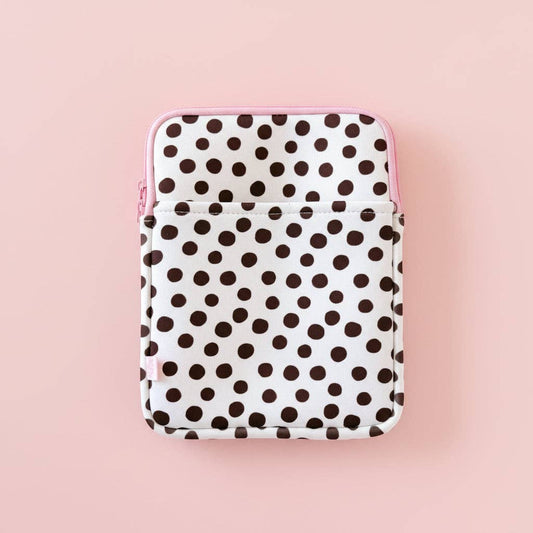 Polka dot patterned pouch on a pink background