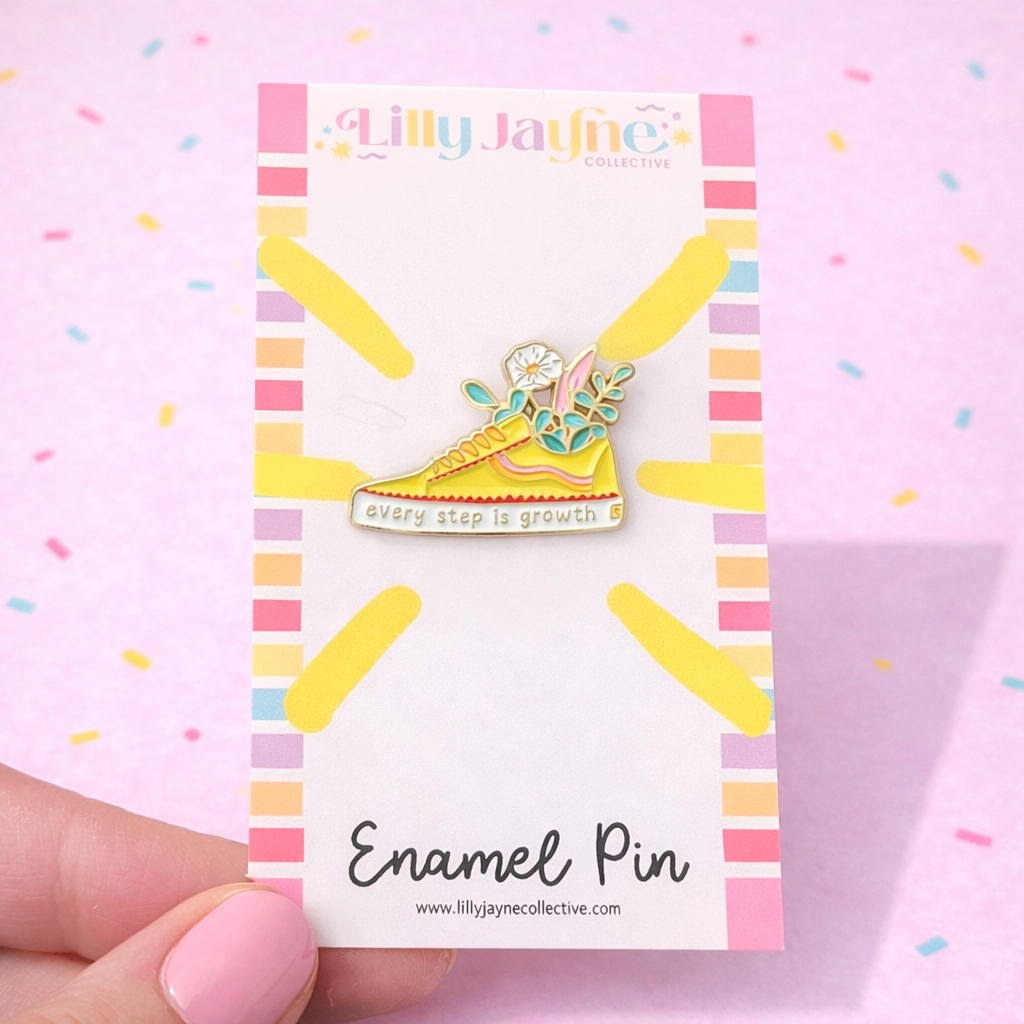 Enamel pin on a colorful card with 'Lilly Jayne Collective' branding