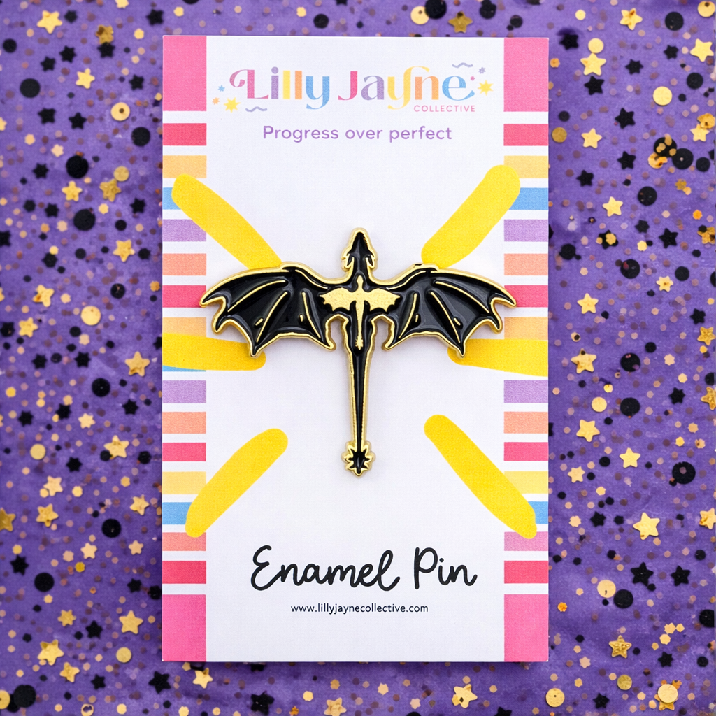 Lilly Jayne enamel pin on a colorful card with a purple background