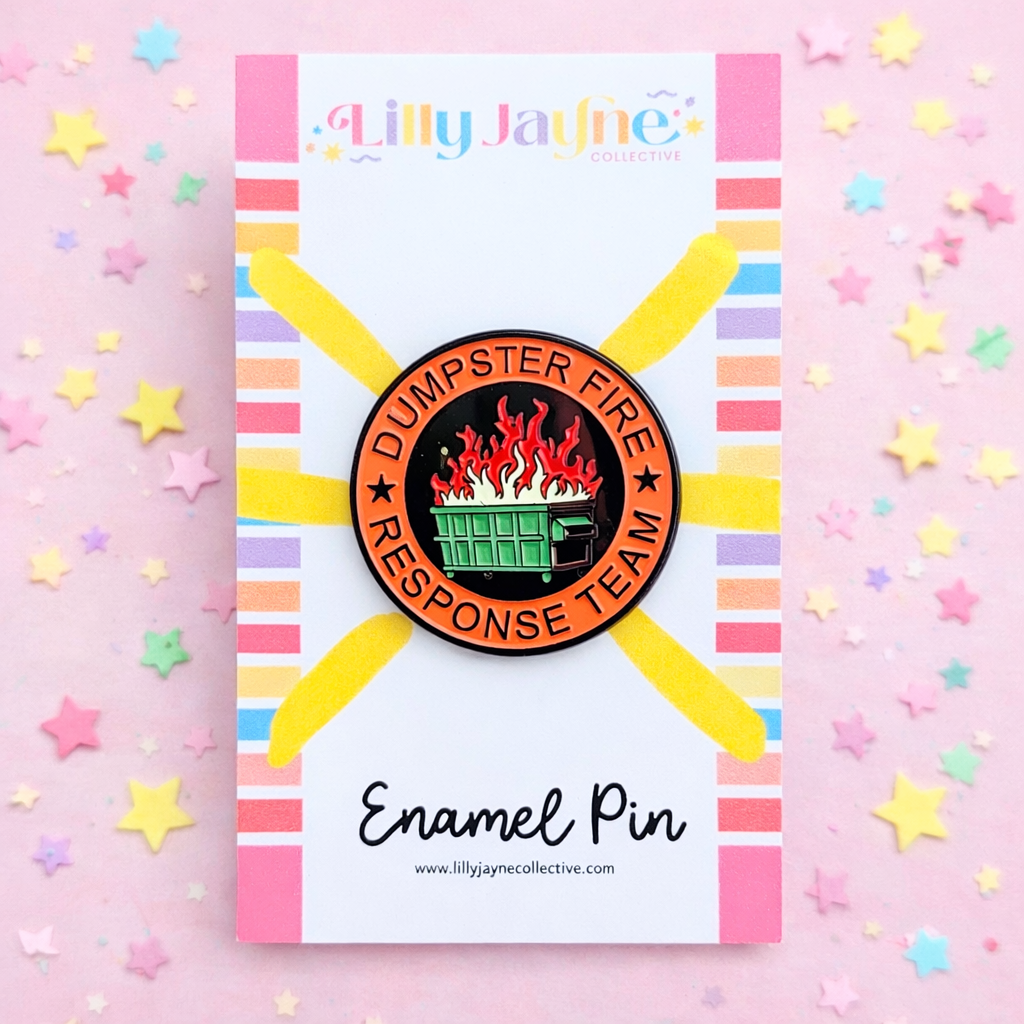 Enamel pin with 'Dumpster Fire Response Team' design on a colorful card with stars.