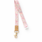 Floral patterned lanyard with a gold clip on a white background