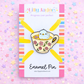 Enamel pin with a bird in a floral teacup on a colorful background