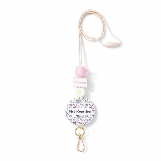 Retractable badge holder with 'Mrs Reardan' printed on a white background