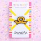 Enamel pin with a heart and dog design on a colorful card with 'Lilly Jayne Collective' branding.