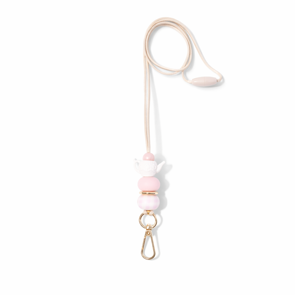 Necklace with pink beads and gold clasp on a white background
