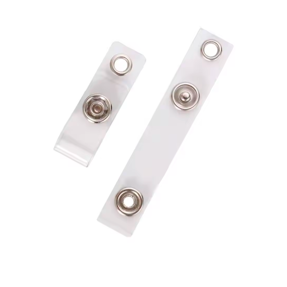 Two clear plastic strips with metallic circular components on a white background